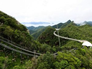 The Langkawi Skybridge surrounded by lush greenery and mountains 