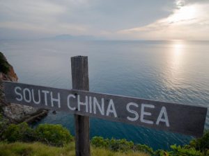 Signpost at the island's peak that's facing the ocean