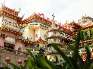 The Kek Lok Si Temple in Penang with brightly coloured lanterns decorating its facade 