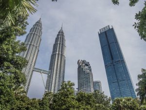 Petronas Twin Towers, Maxis Tower and The Four Seasons Kuala Lumpur during the daytime 